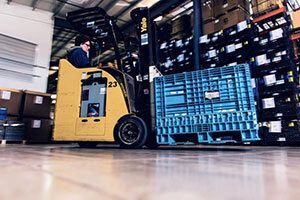 Worker driving a forklift.