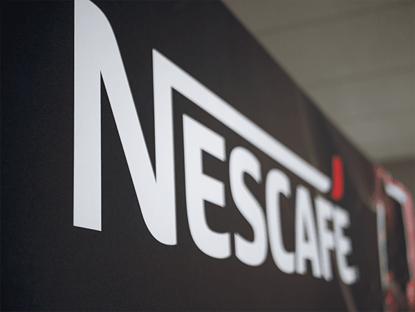 10'x8' tension fabric display featuring a large Carnegie Companies logo centered on a blue background