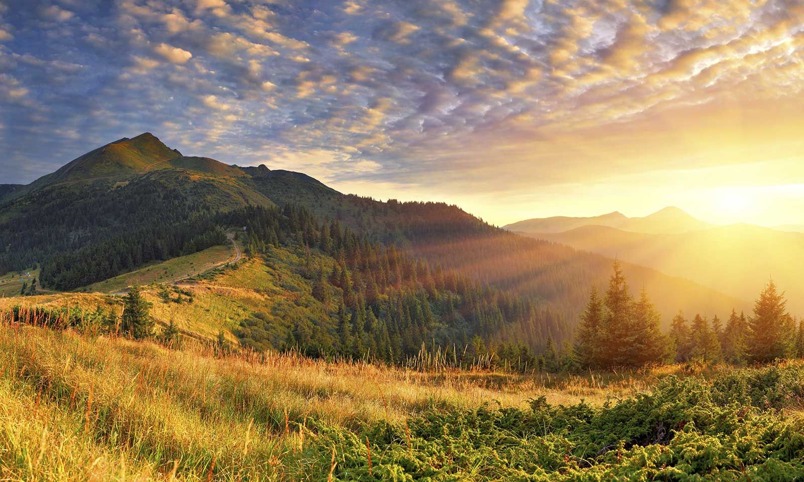 sunrise coming up over the mountains