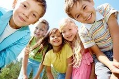 Group of kids smiling.