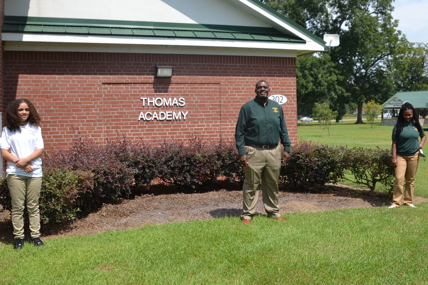 Principal Ward with two students enrolled in Thomas Academy after experiencing the SOAR summer program.