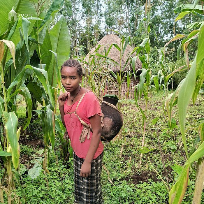 Demekech working. She is going to collect water.