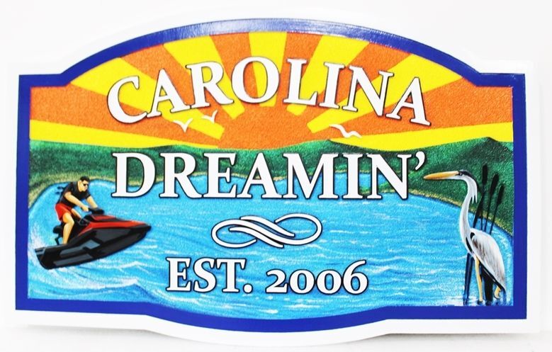 L21210A - Carved Seashore Home Sign, "Carolina Dreaming” , features a Bay Scene with a crane, a Jet Ski and a Stylized Setting Sun