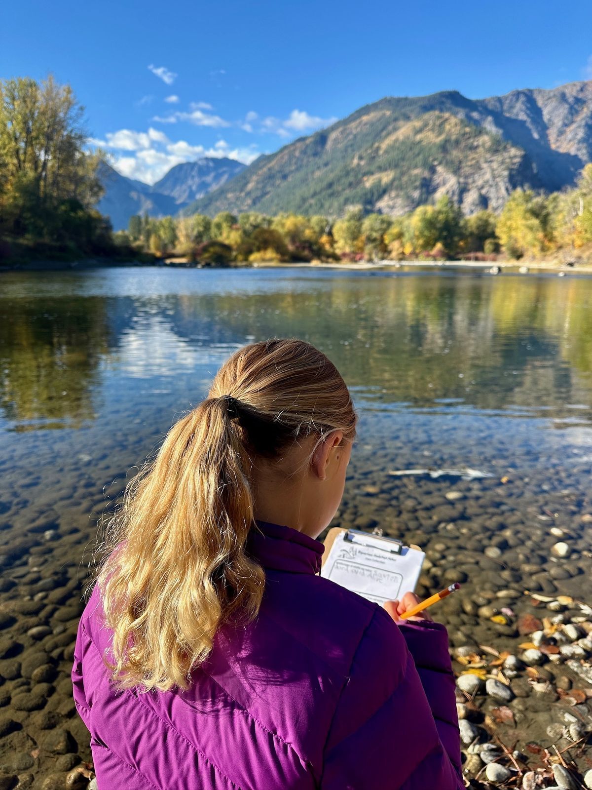 Girl sitting by a river painting