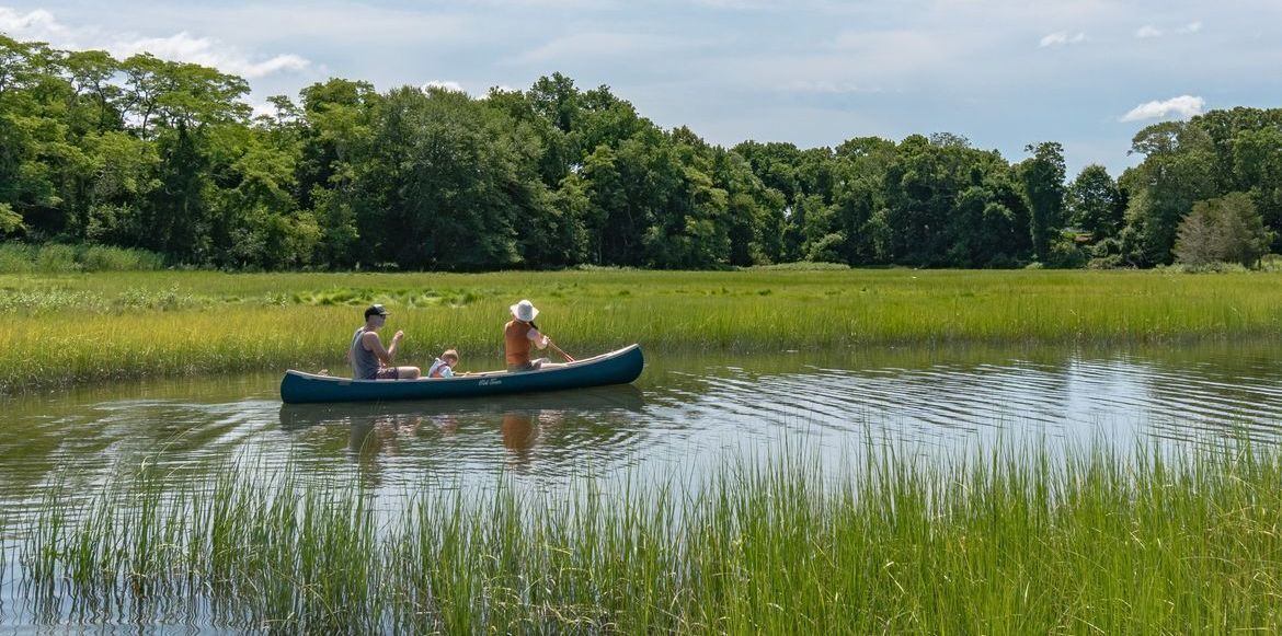 Family canoeing at Audubon Touissett Wildilfe Refuge