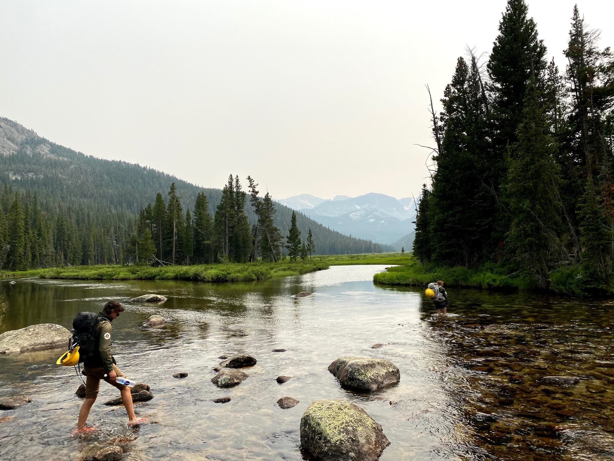 A man crosses a river