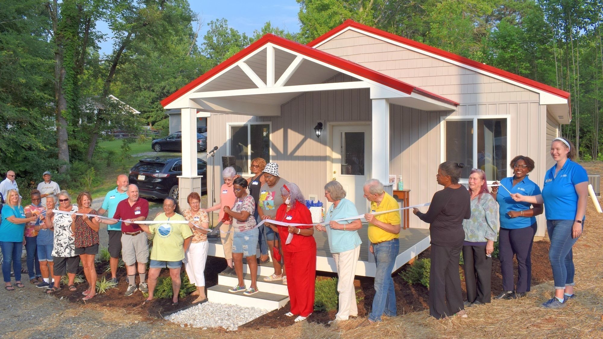 Habitat homeowner cuts ribbon on new home with her three children