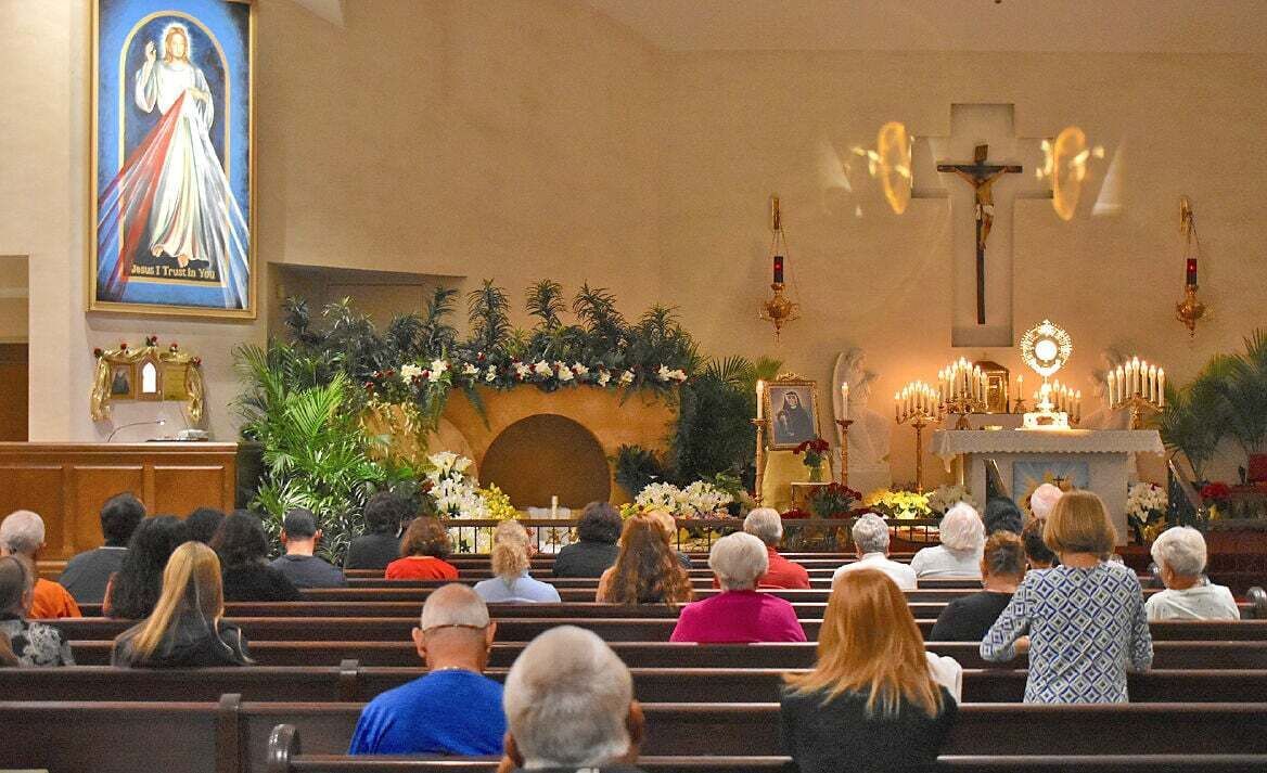 The faithful gather on Divine Mercy Sunday, April 27, 2025, at St. Andrew Church in Stuart for Eucharistic adoration, to pray the rosary and Divine Mercy chaplet, go to confession and Mass. A first-class relic of St. Faustina Kowalska is on display.
