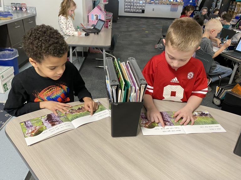 Young students reading books.