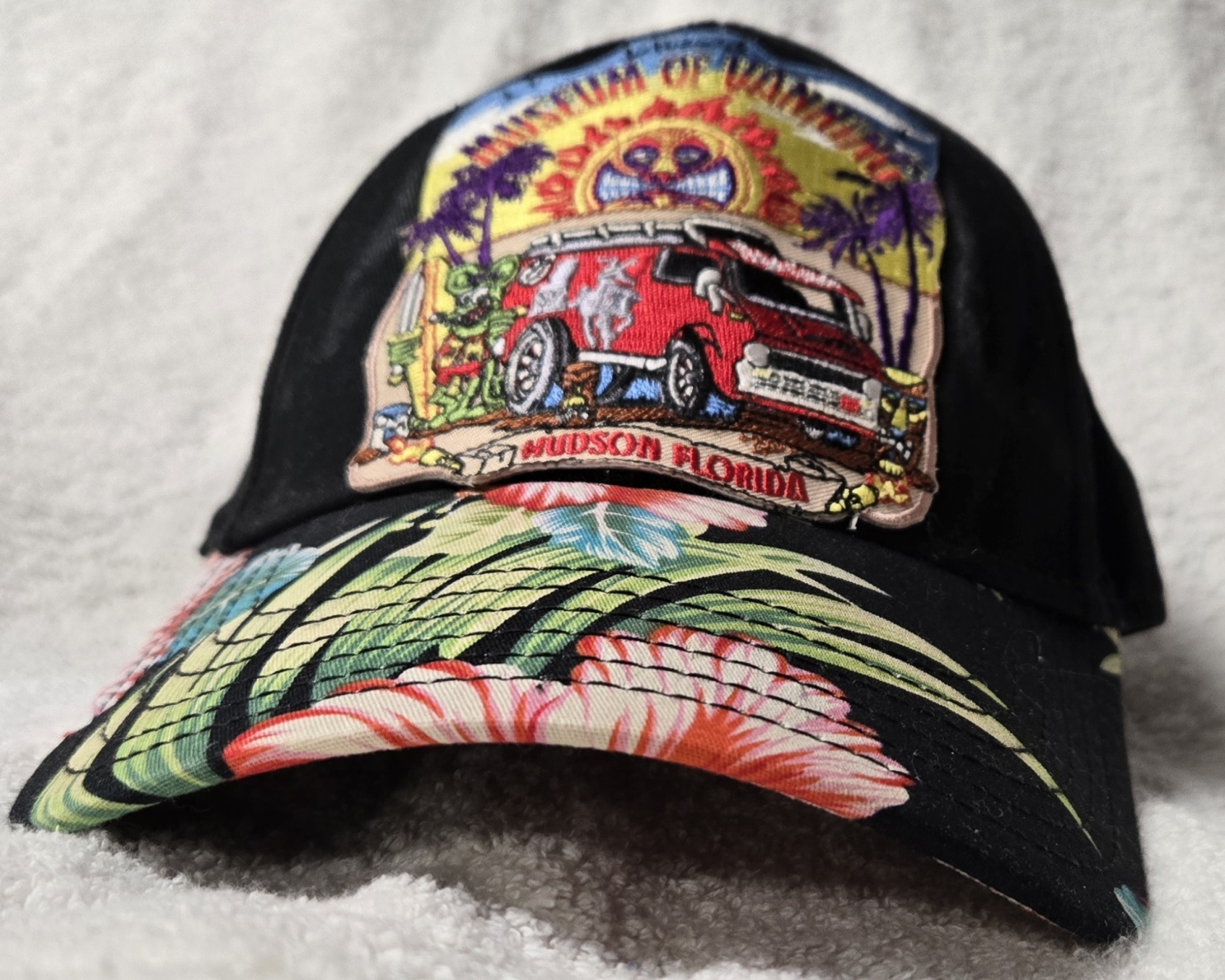 Museum Logo Black Cap - Bill has large pink flowers