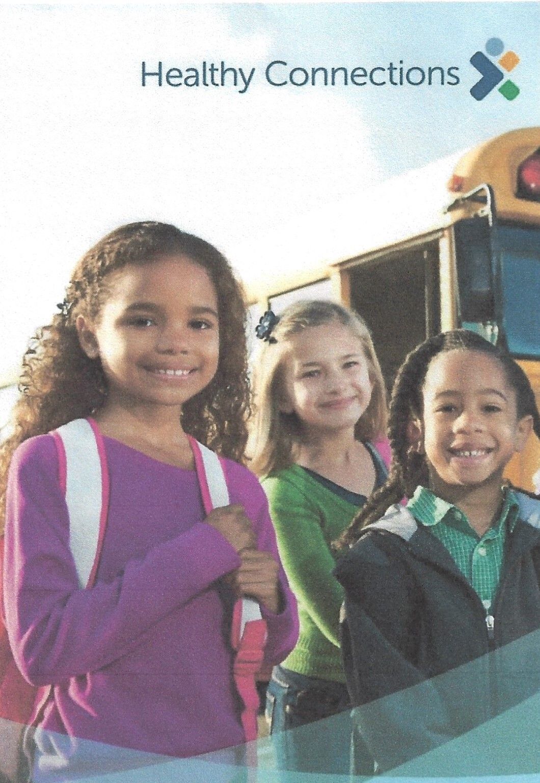 Children standing in front of a school bus