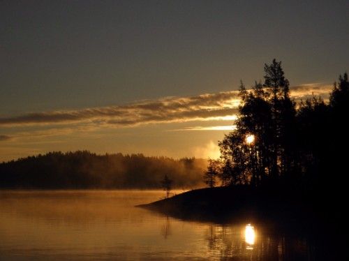 Sunset over lake and mountains in Savonlinna, Finland