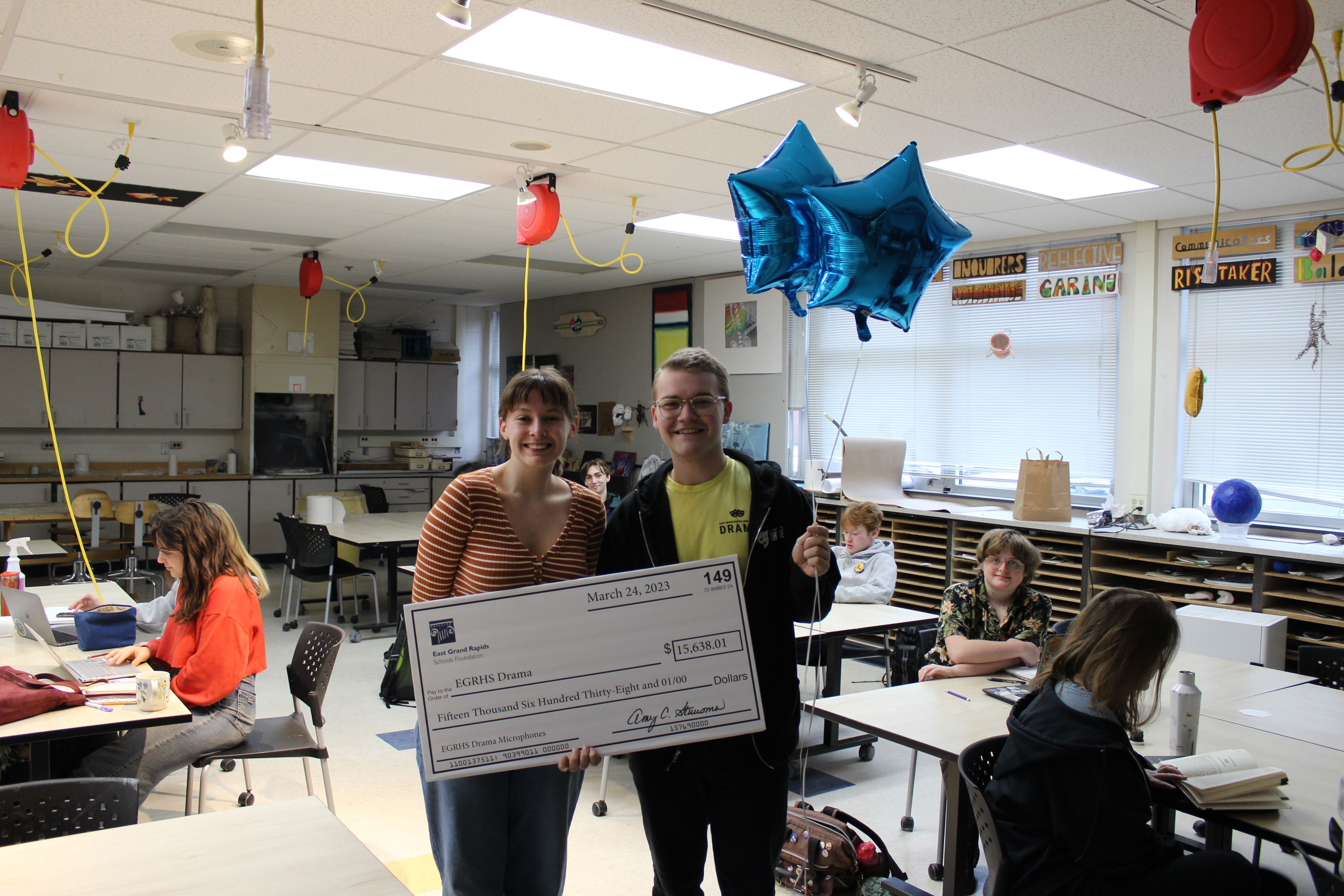 photo of Marcus Chapman with big check