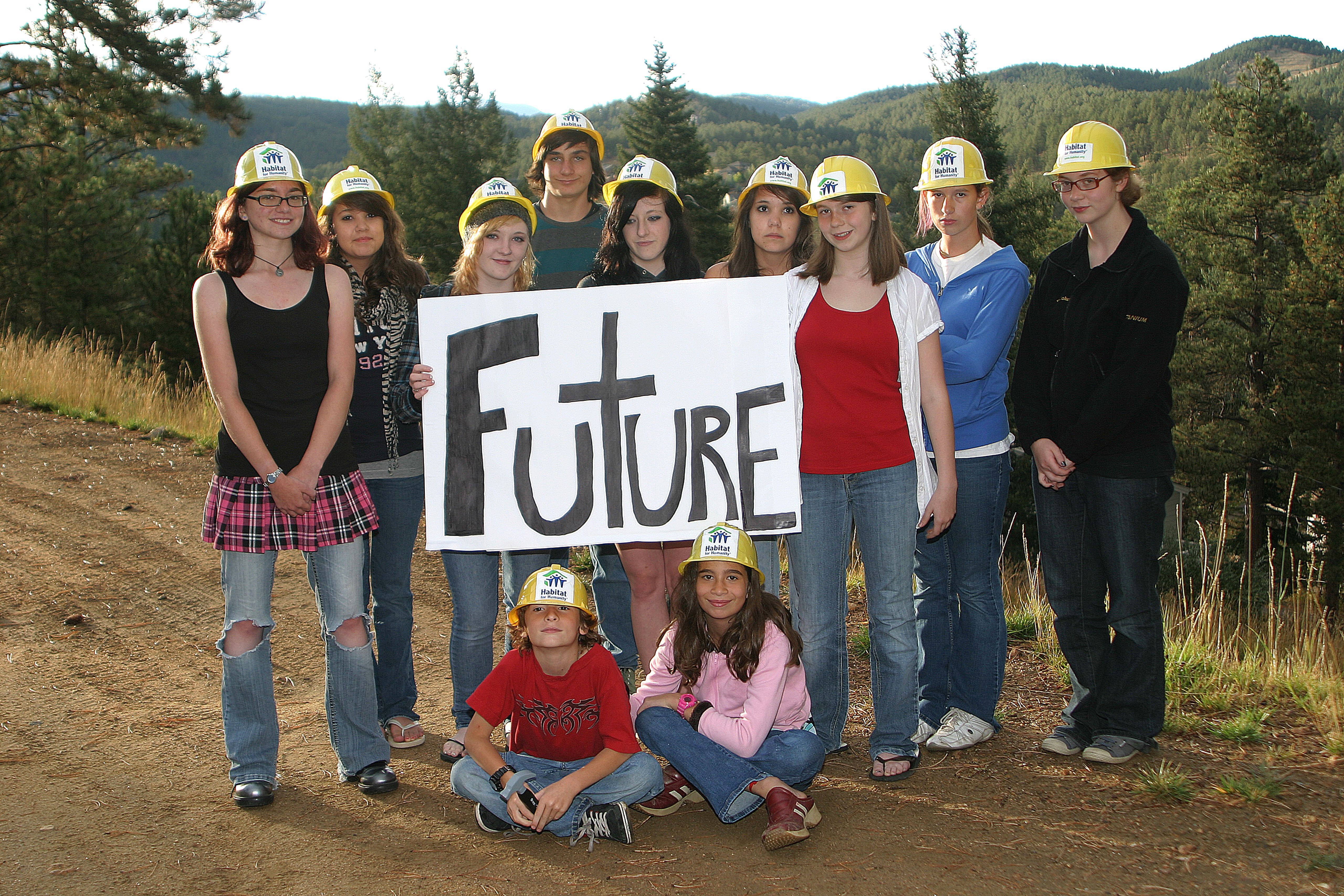 Youth volunteer group holding sign that says "Future"