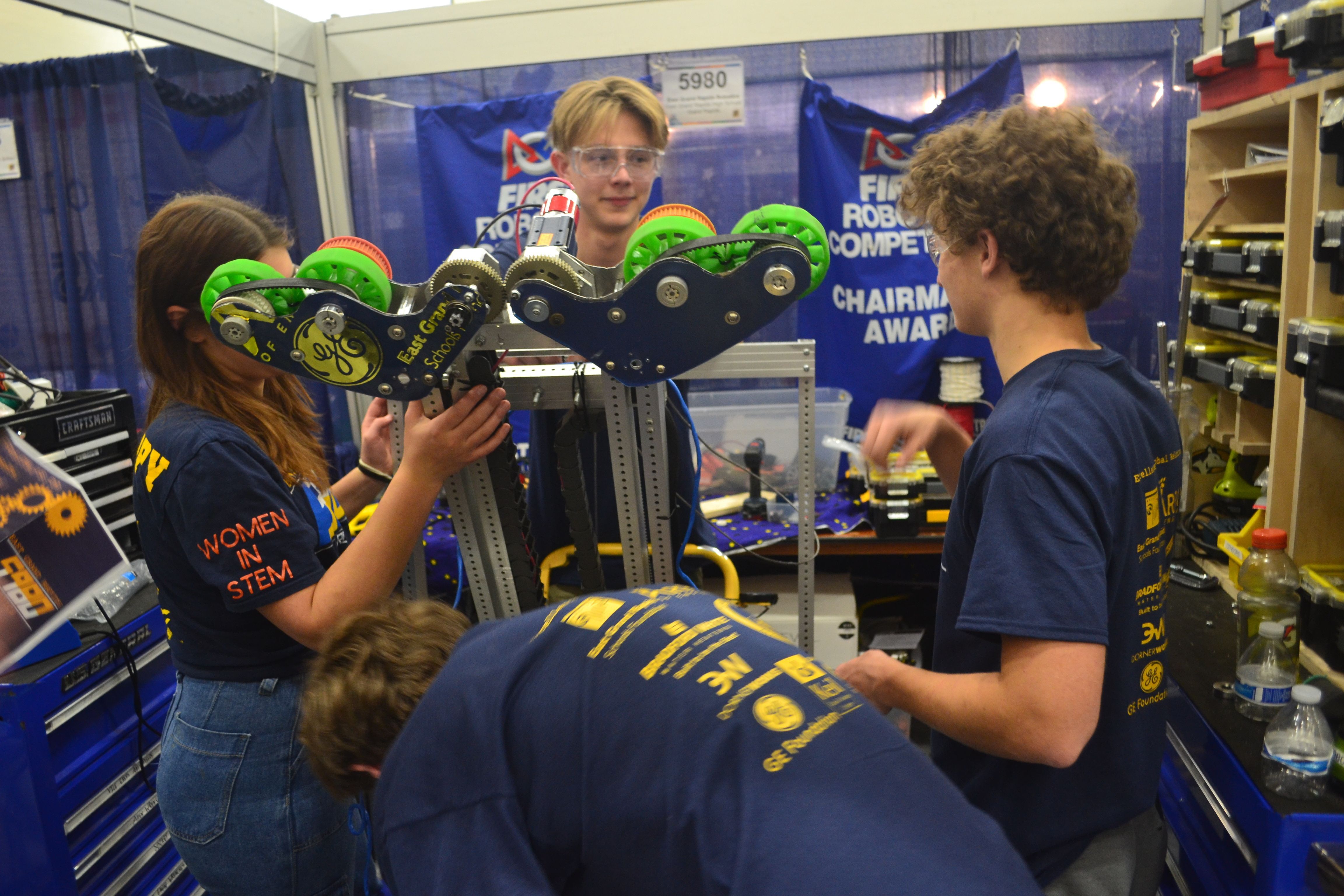 photo of robotics team with robot