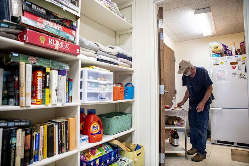 Man working in a food pantry.