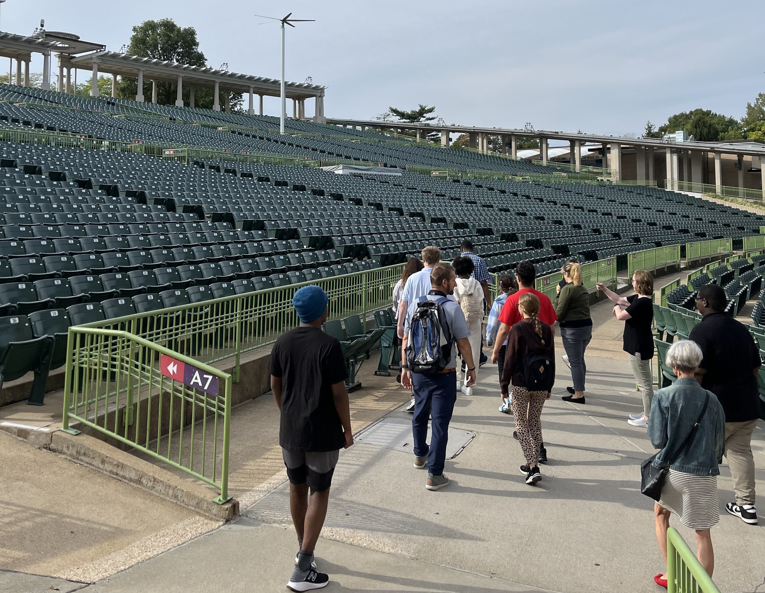 students walking through a tour of an outdoor theater