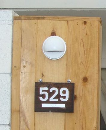 T29193 - Rustic  Redwood Room Number Plaques Mounted on Wall