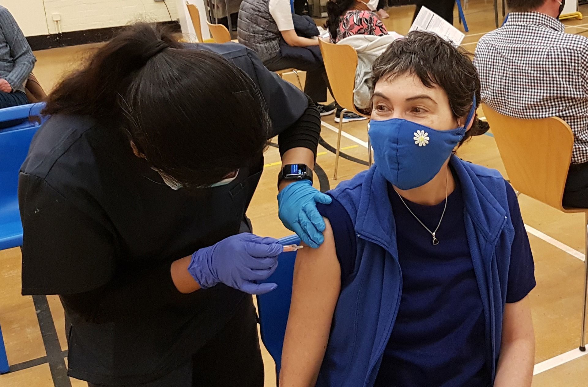 A person receiving their flu shot