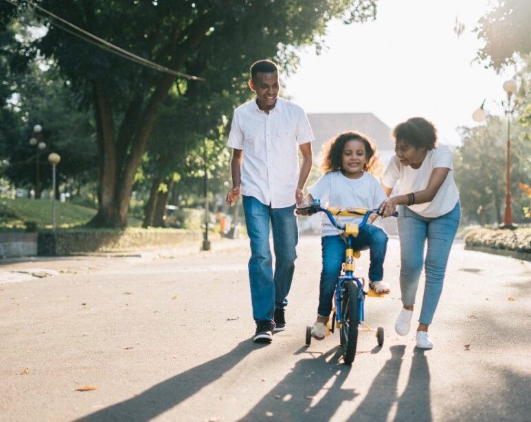 Girl learning to ride a bike