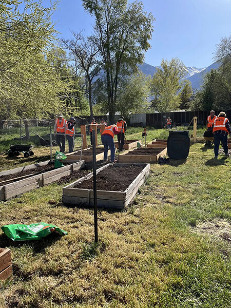 Several volunteers working at the community garden.