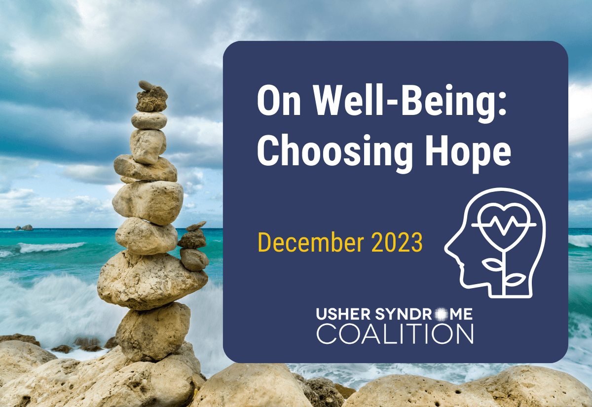 A photo of a stack of rocks balanced on the beach with the ocean visible in the background. White and gold text on a navy background reads: On Well-Being: Choosing Hope. December 2023. The Usher Syndrome Coalition logo is below the text.
