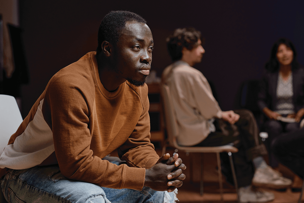 Man sitting in a group meeting