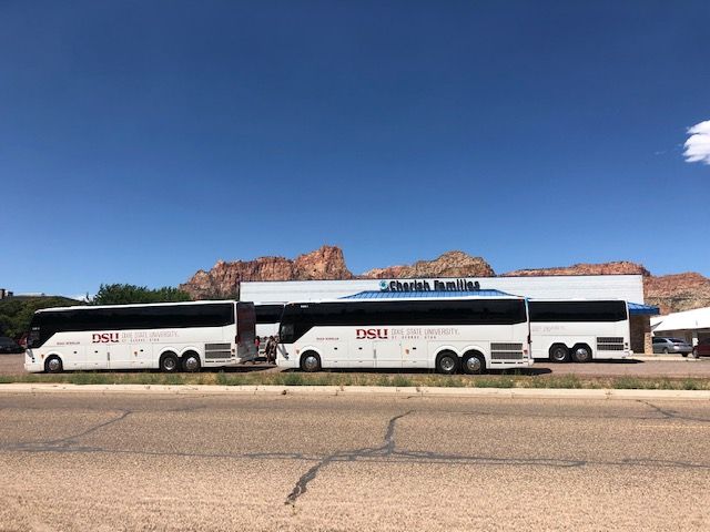 DSU Buses in front of Cherish Families Resource Center