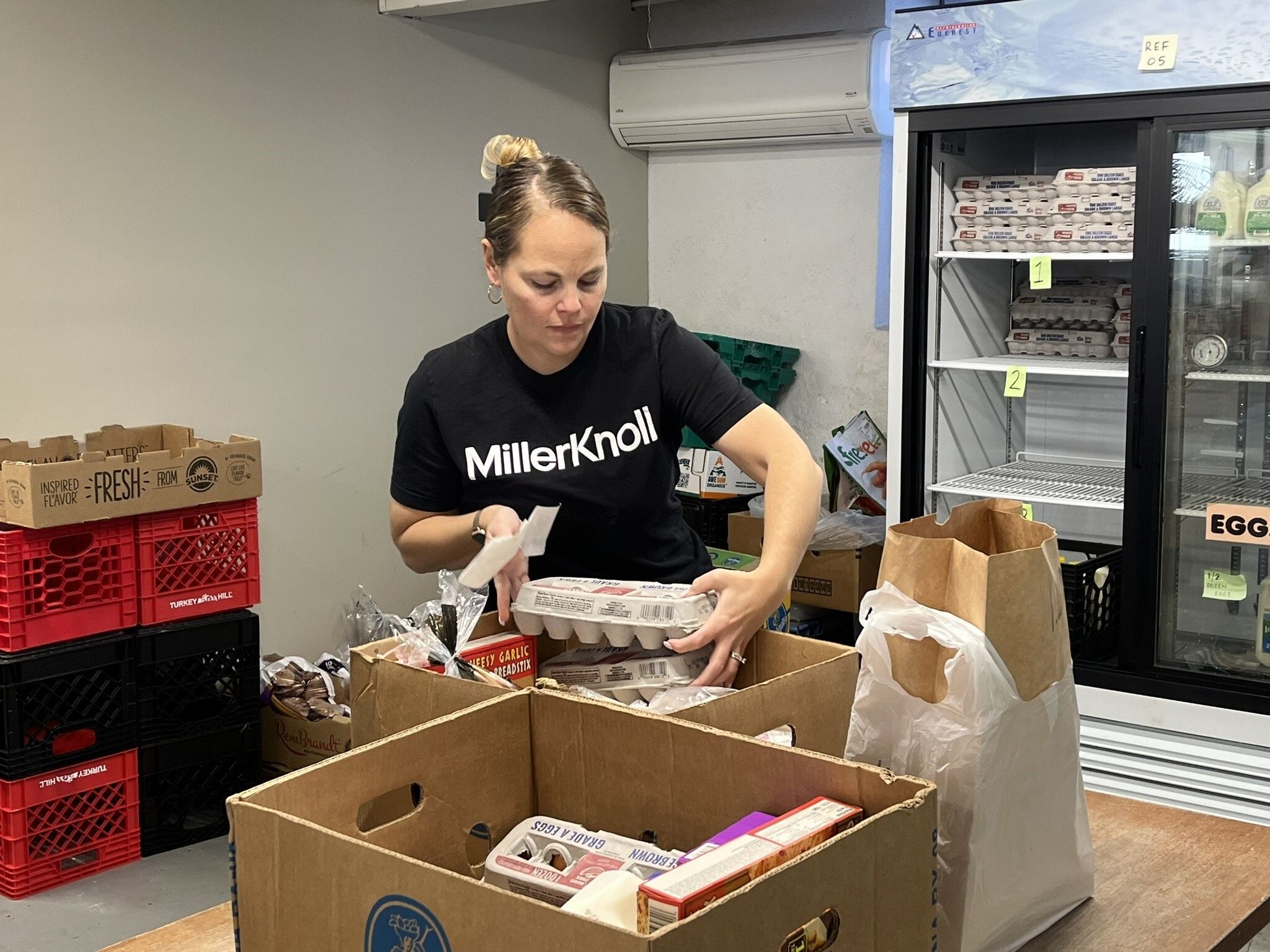 Volunteer packing food bags