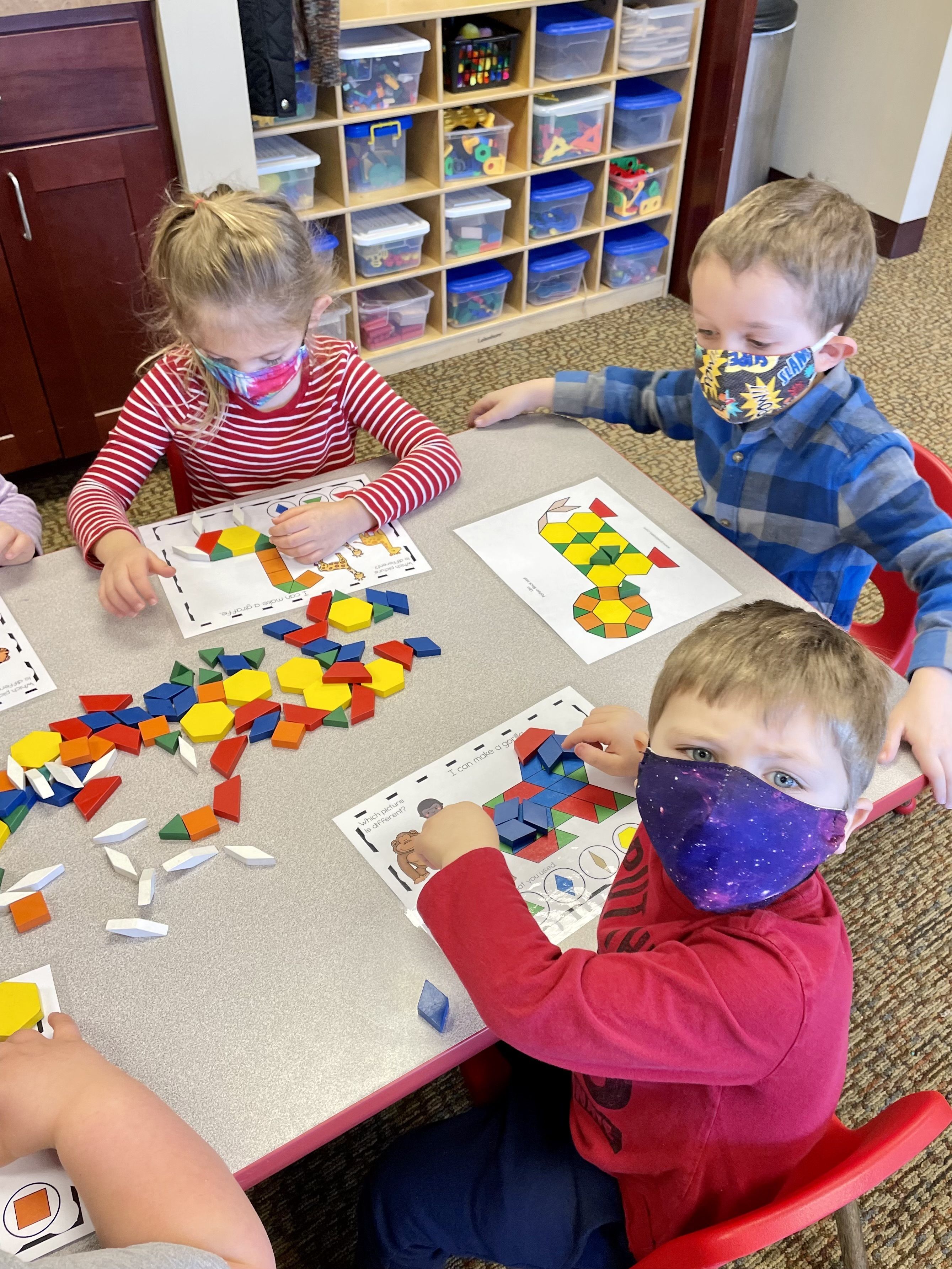 Preschool students doing a color activity