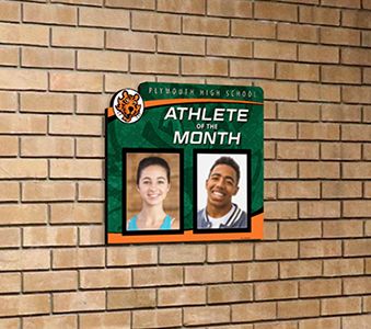 School hallway with athlete of the month picture display, custom signs, school signage company