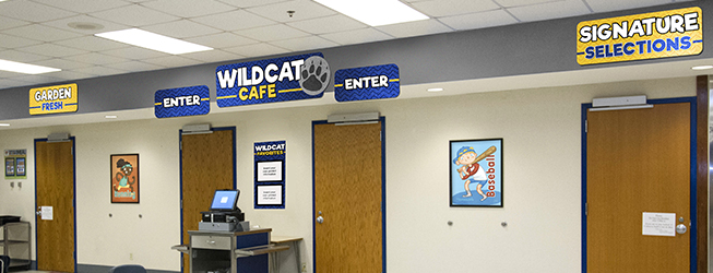Custom school signs in a cafeteria entrance, school spirit signs with custom logo, menu board