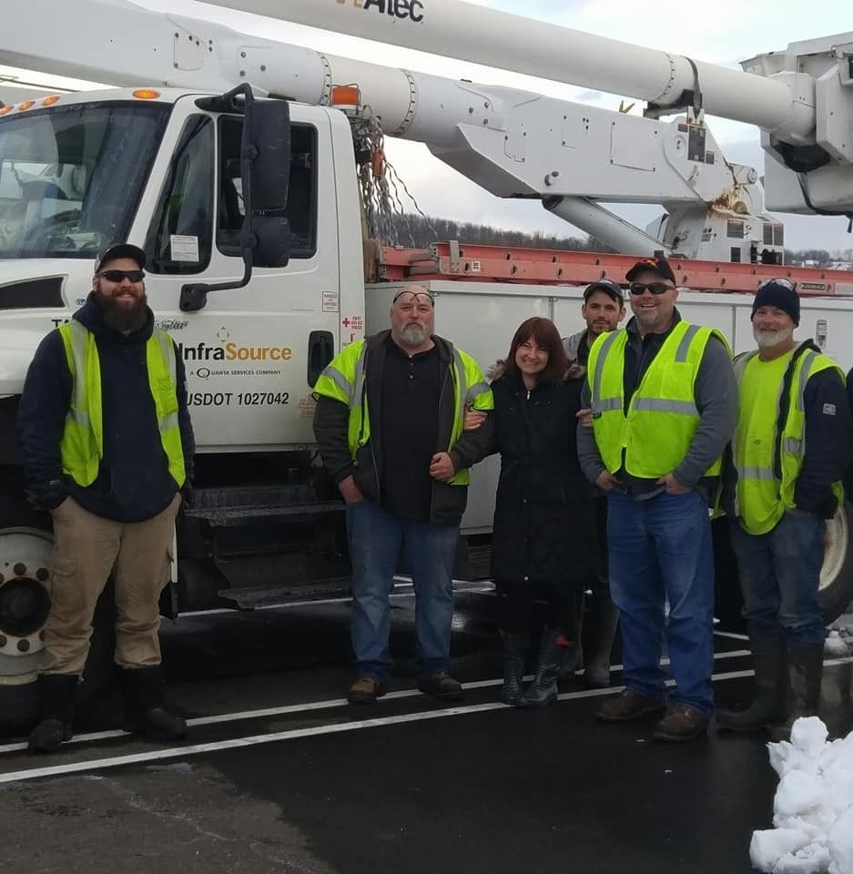 Local linemen give donations, originally offered to them from the community, to A Woman's Place in a generous gesture.