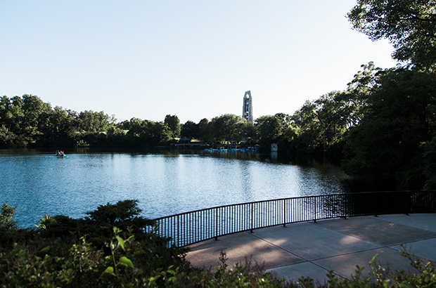 An image of Downtown Naperville's River Walk showing the Millennium Carillon in the background