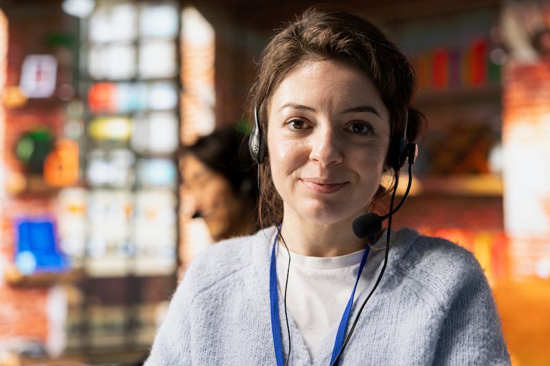 Young woman providing phone support to those in need