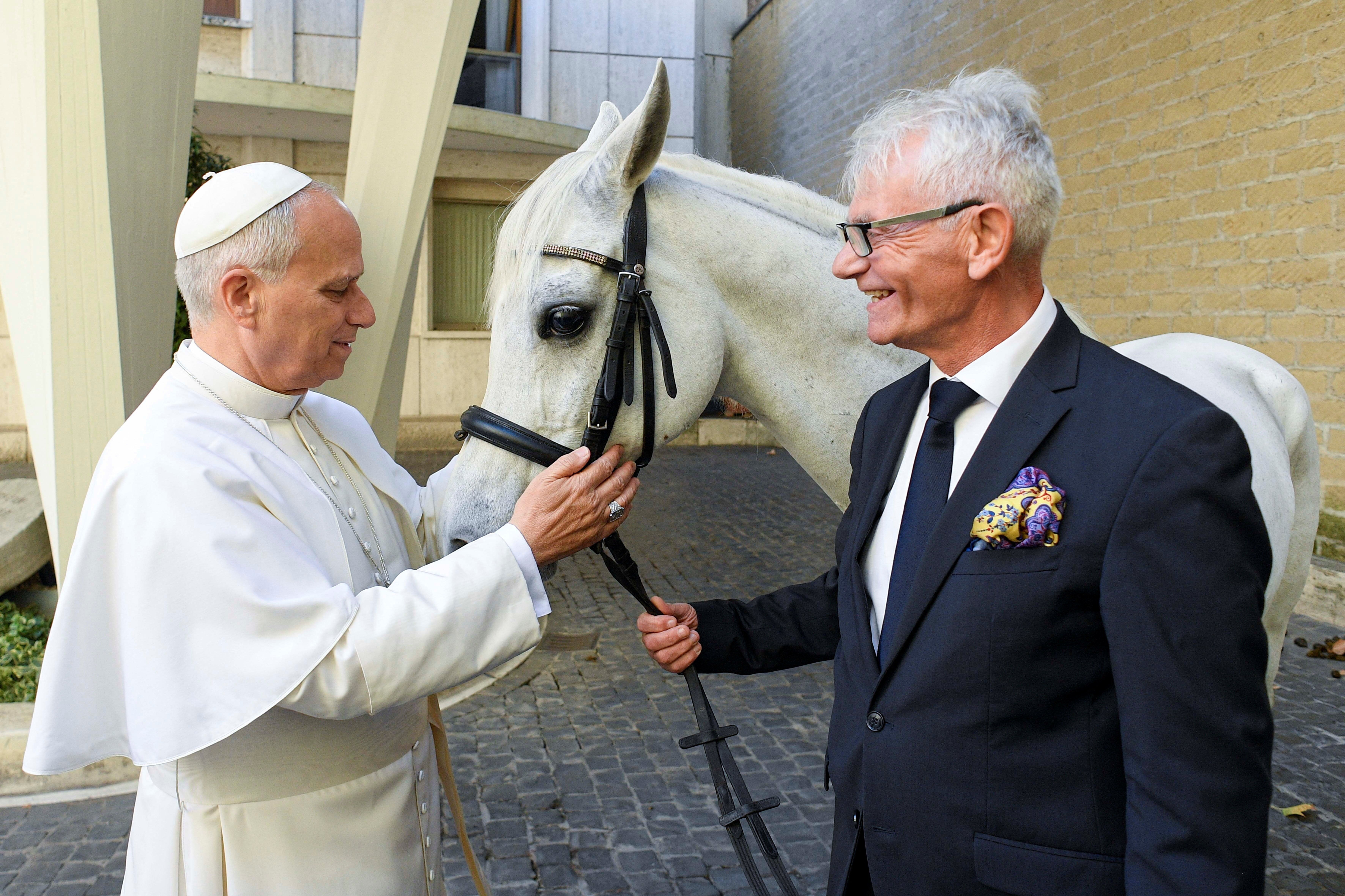 Pope Leo IXV receiving the gift of a white horse from Andrzej Michalski