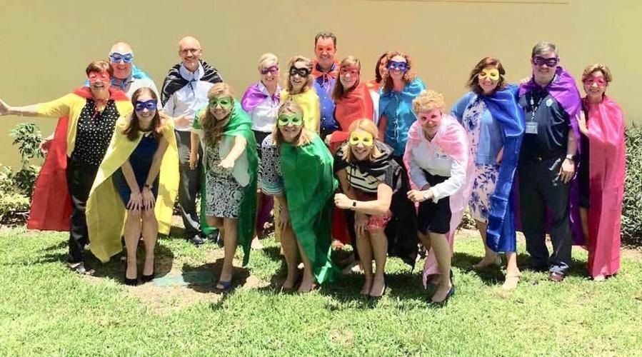 Gary Gelo, retiring superintendent of Catholic schools, back left, with some of the "superhero" administrators he has worked with for nearly 15 years.