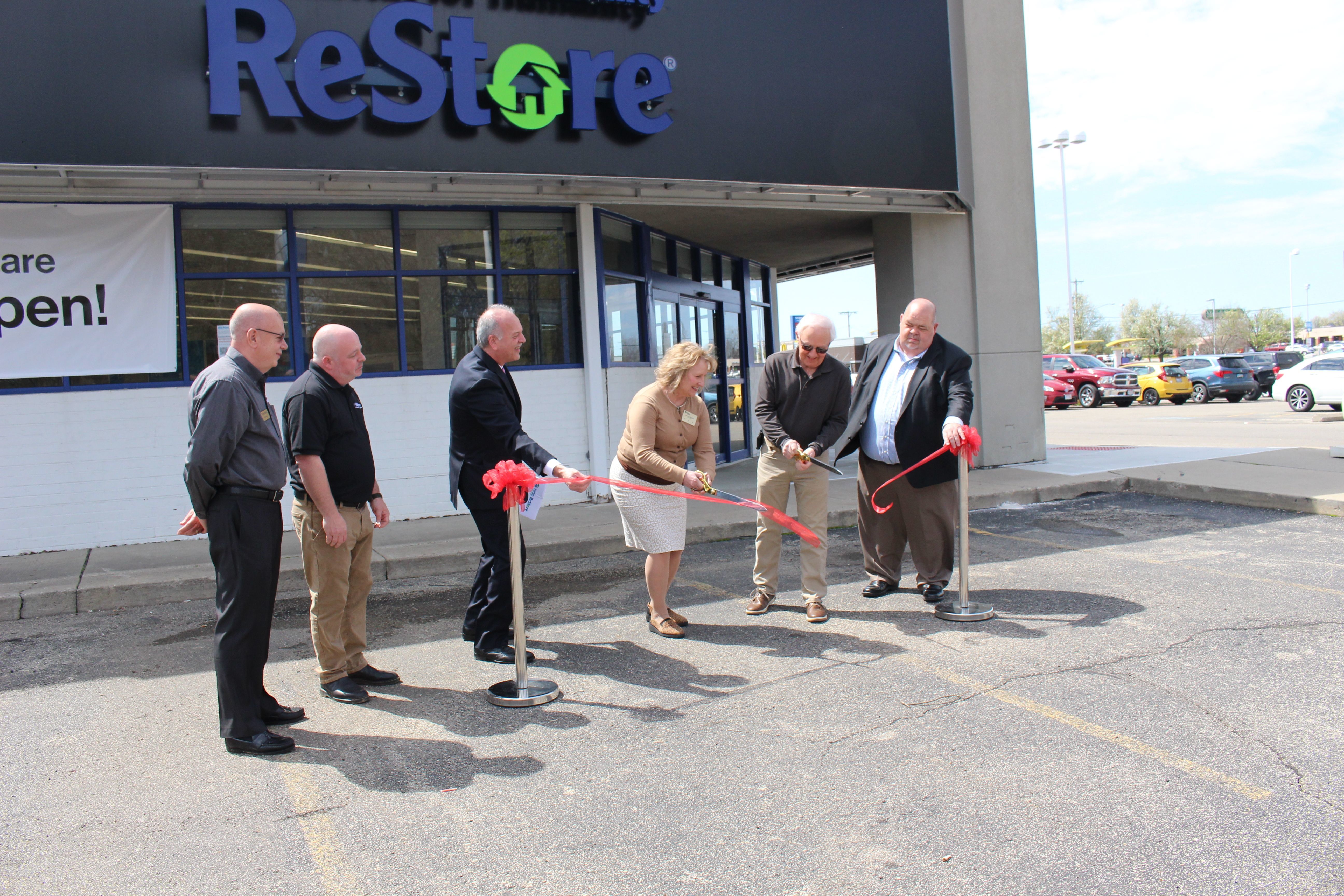 Officials cut the ribbon at the Springfield ReStore.