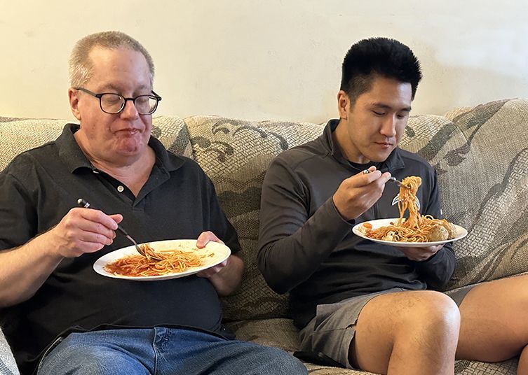 Friendly Visiting match David and Phillip enjoying spaghetti.