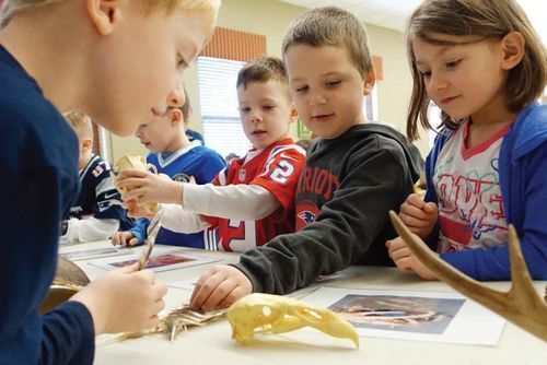 Students explore prop box contents