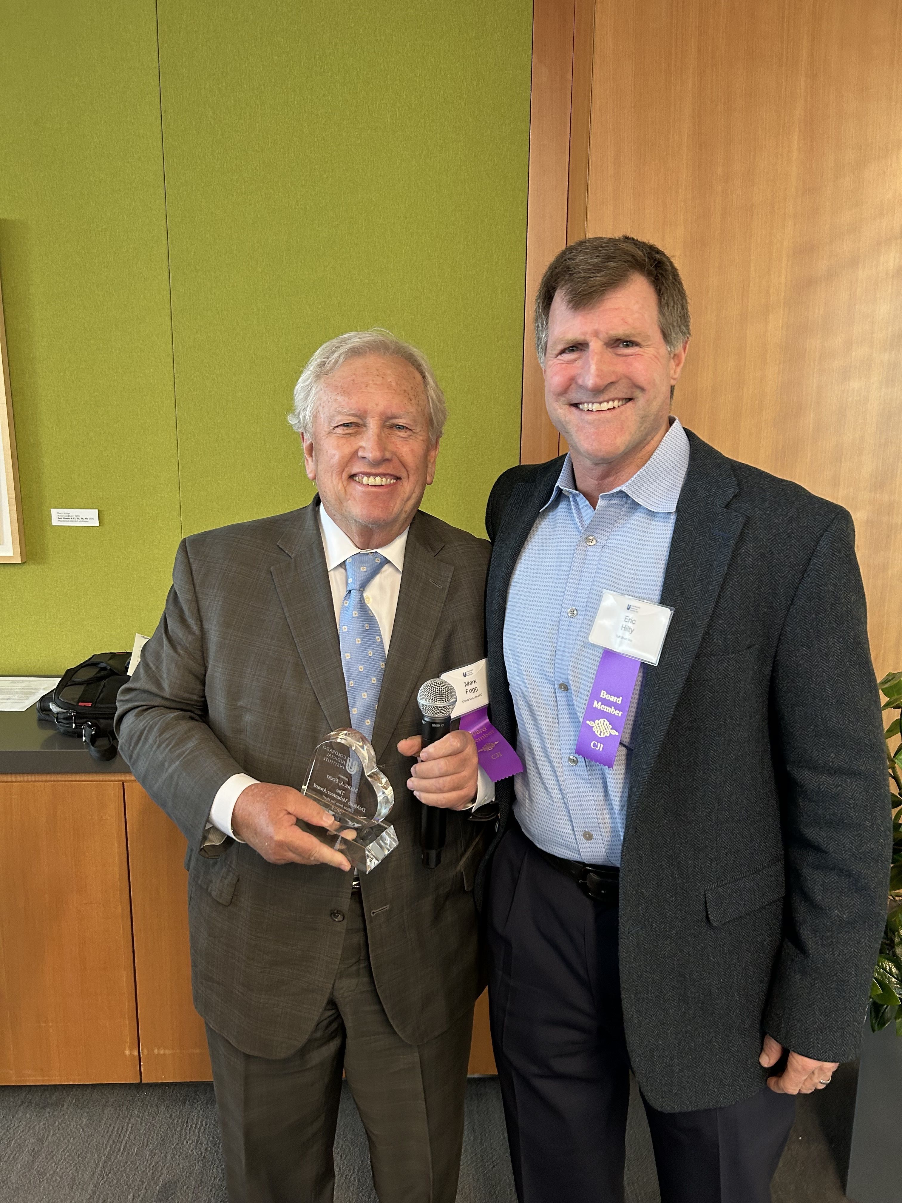 Mark Fogg accepts CJI's Volunteer of the Year Award from Eric Hilty