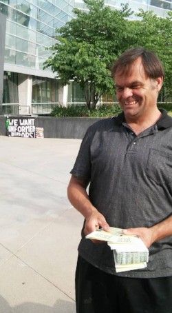 Eric Brandt shares FIJA Fresh Air for Justice brochures outside the Lindsey-Flanigan Courthouse