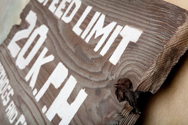 H17250 - Carved Rustic Sandblasted Reclaimed Wood "Speed Limit 20 KPH / Warthogs and Children Have the Right-of-Way" Traffic Sign 