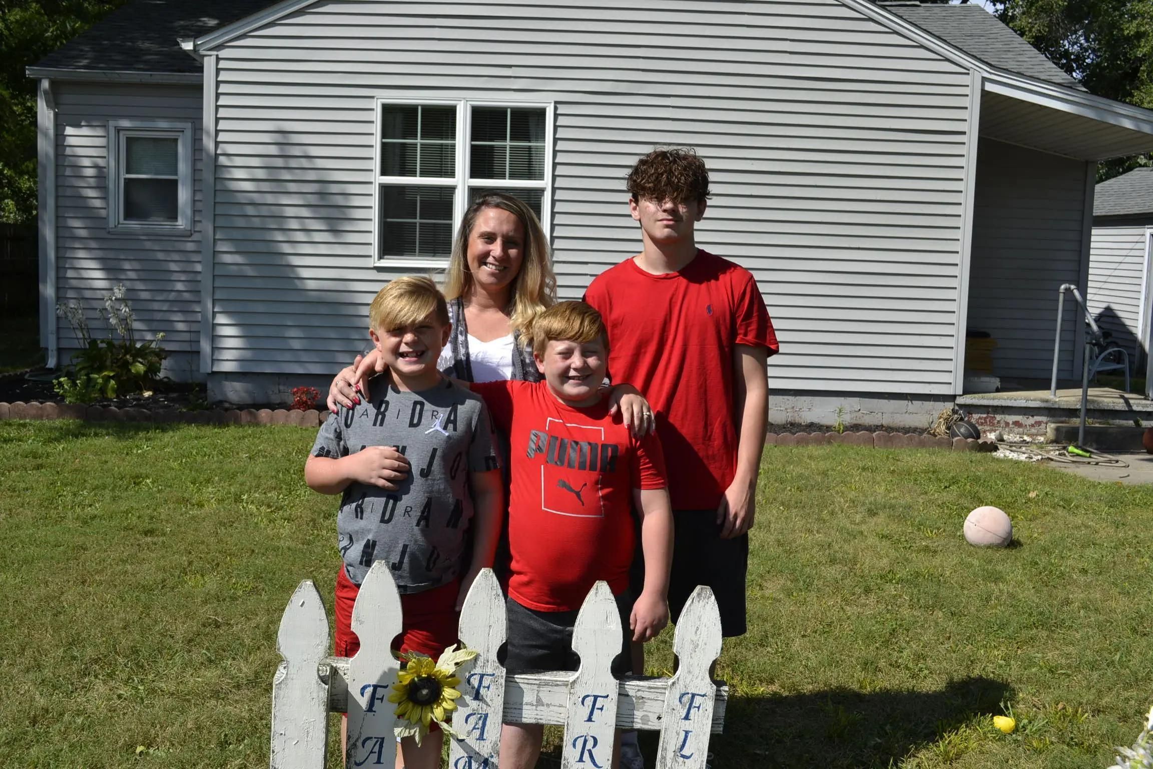 Family in front of their house.