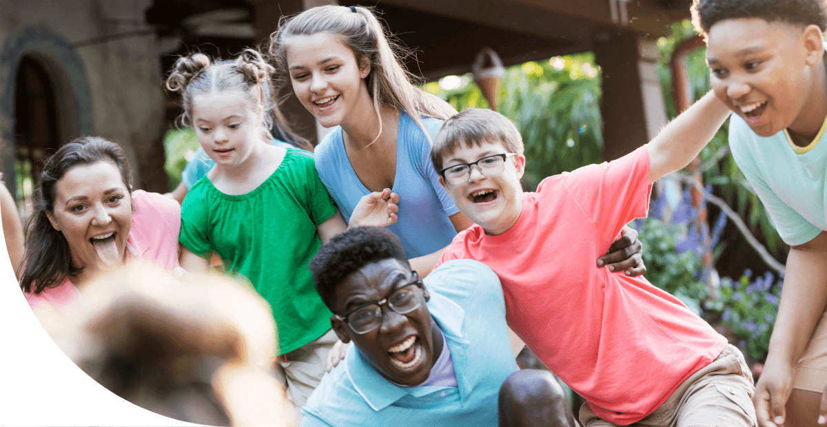 kids in a group smiling and running