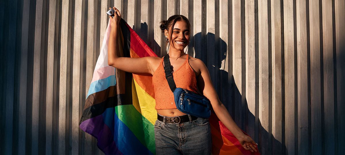 girl holding pride flag