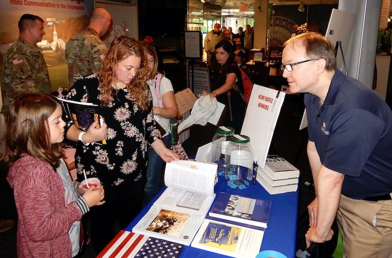 Visitors to the NCMF Table