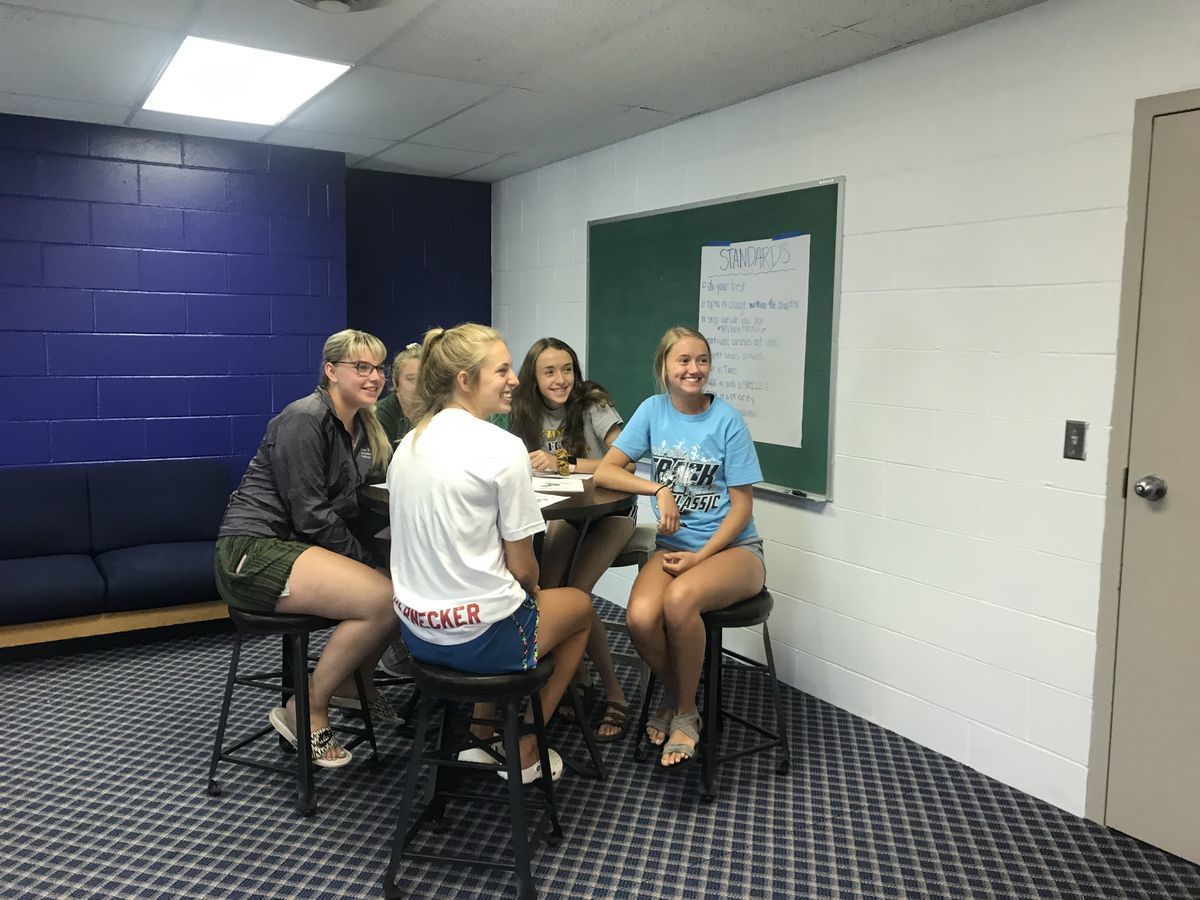 A group of young people having a discussion.