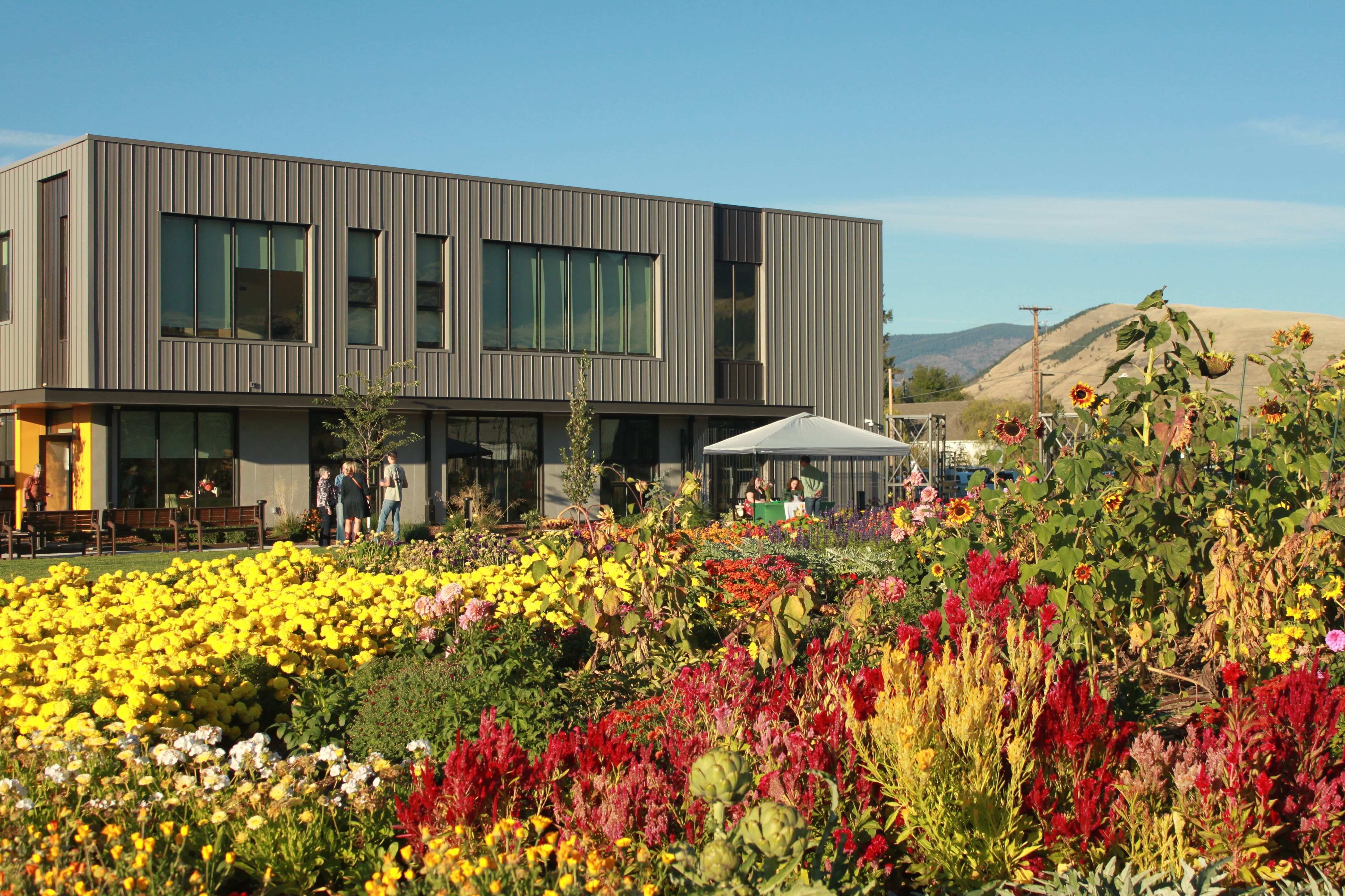 Building with flowers in the flowers in front