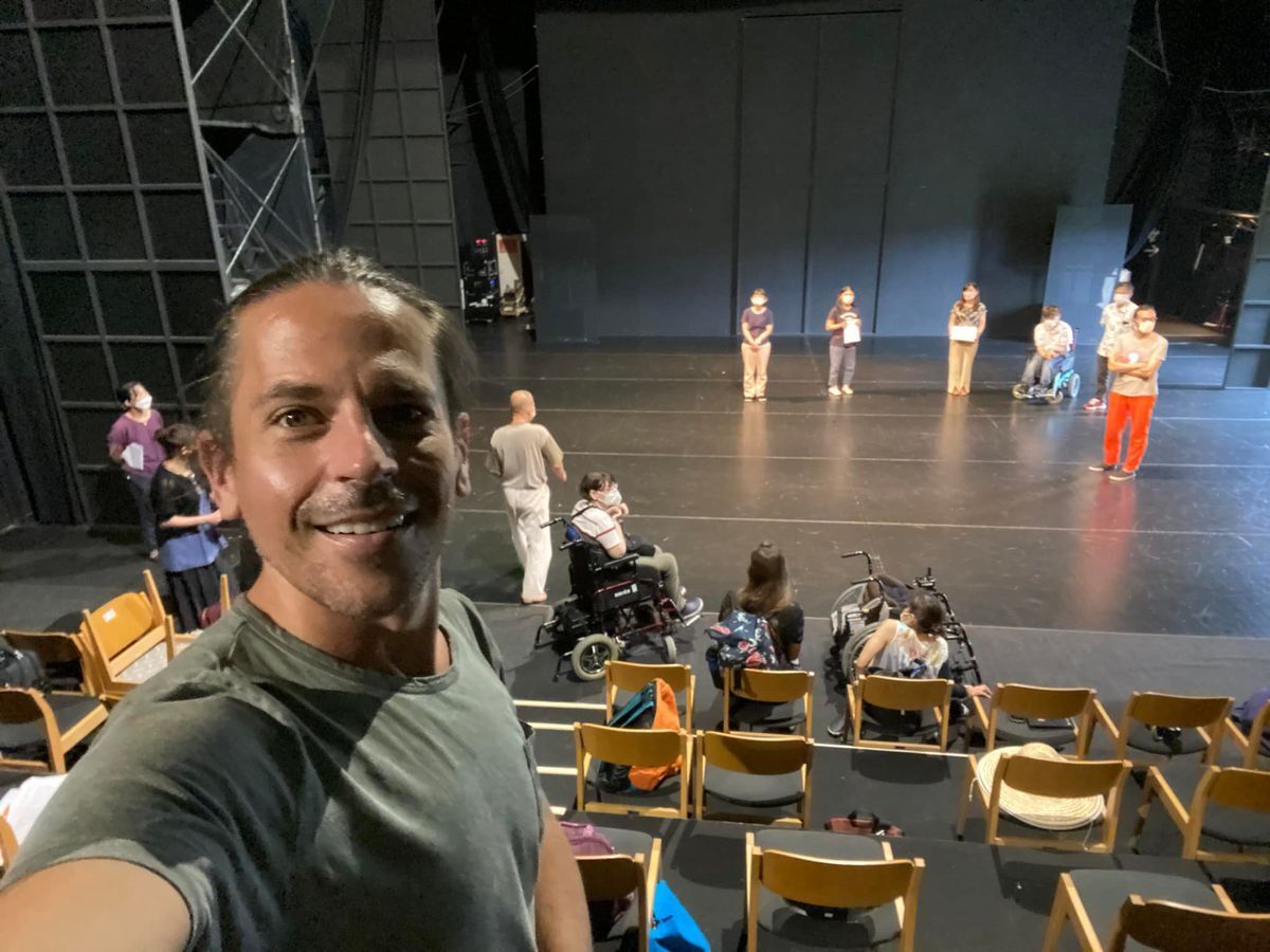 A picture of Stephen Matthews who is taking a wide shot of the theater rehearsal for the play. 